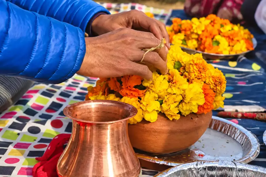Asthi Visarjan in Varanasi (Kashi) showing a client putting garland on asthi kalash