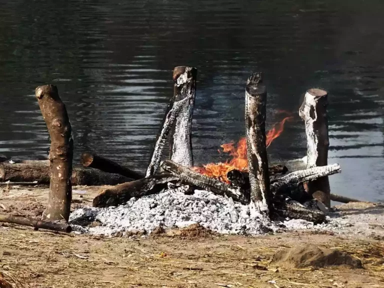 View of flames and remaining ashes during the cremation of a body