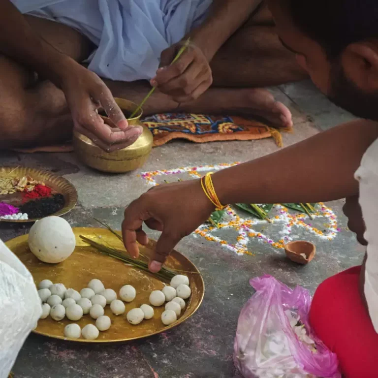 Chaturdashi Shradh 2026 — devotee performing tarpan during Pitrupaksha at Triveni Sangam