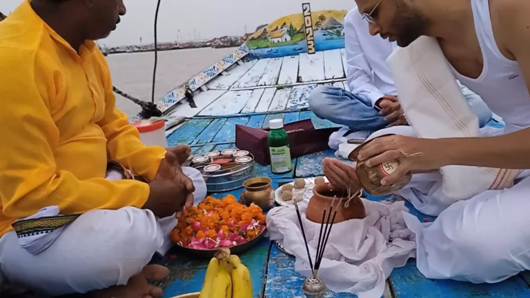 A devotee performing asthi visarjan pooja