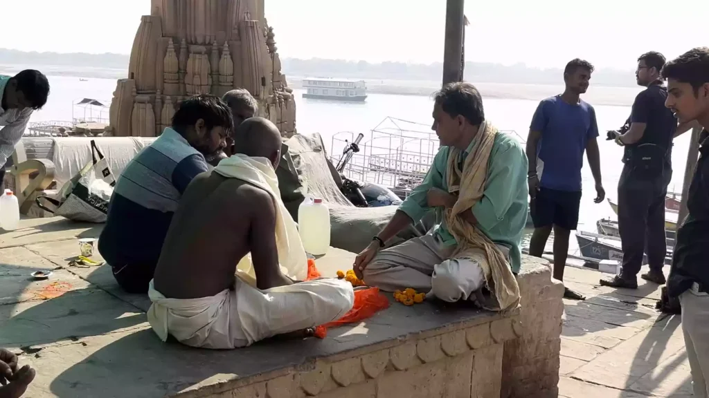 I heard about scams targeting pilgrims in Varanasi How can I be careful?