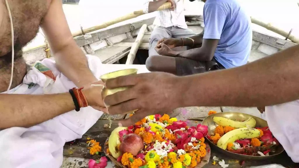 Are there any specific precautions to take while at the Sangam especially regarding the rivers or crowds?