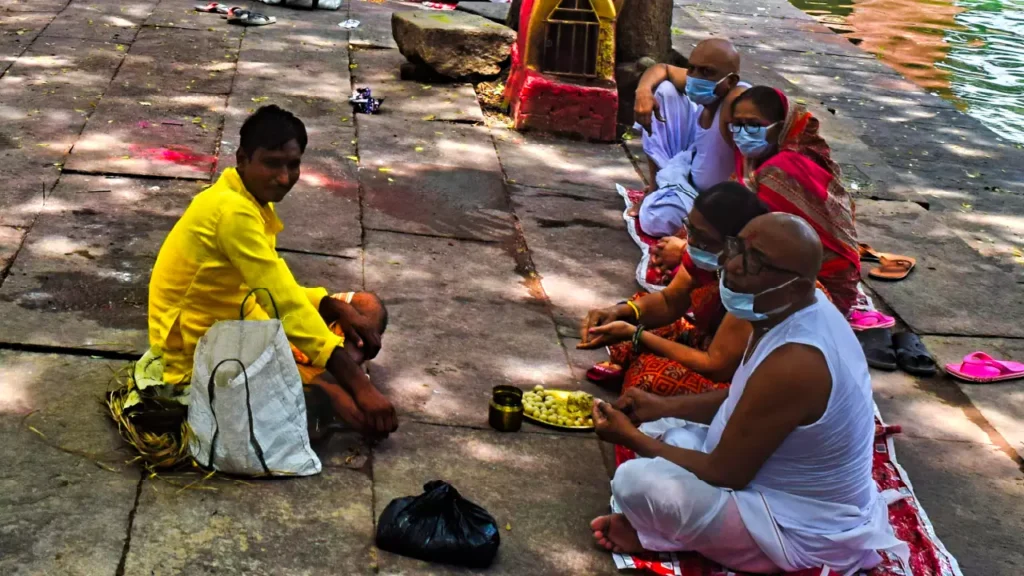 A family performing varshik shradh at ram kund in gaya