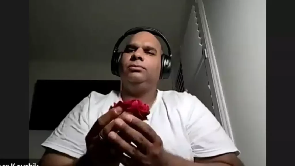 Photo of a person praying during online Asthi Visarjan in varanasi