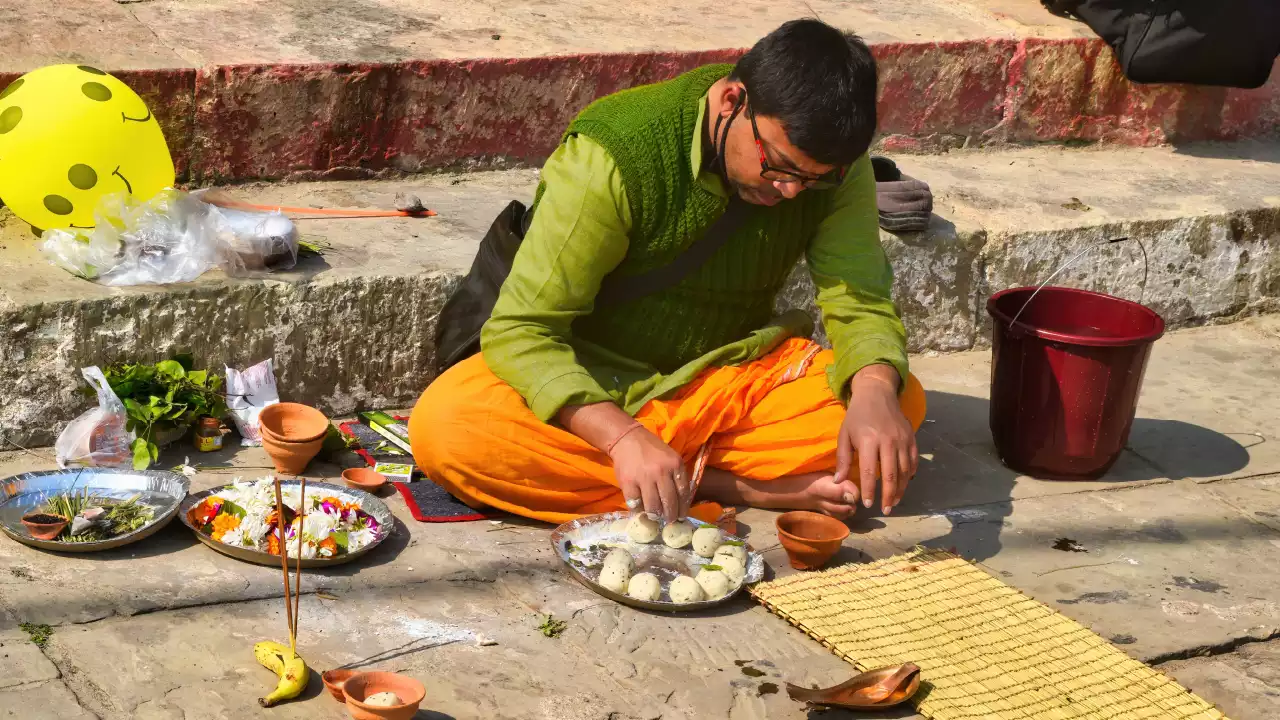 Photo of a Person preparing pind balls for pind daan in varanasi-Online Pind Daan for Non-Resident Indians