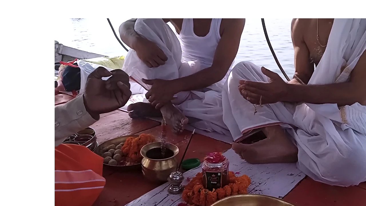 Family performing Asthi Visarjan ritual at Triveni Sangam