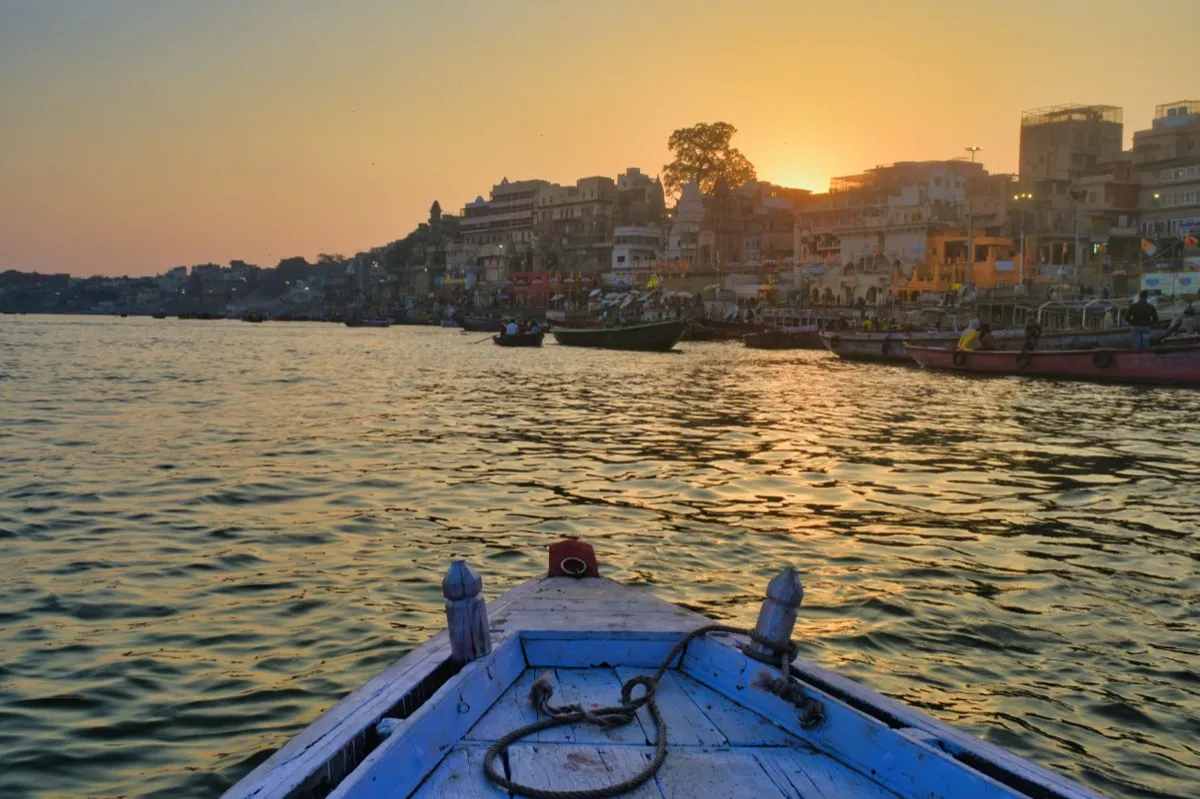 Boats on the Ganga at sunset, Varanasi — a sacred city central to Hindu death rituals