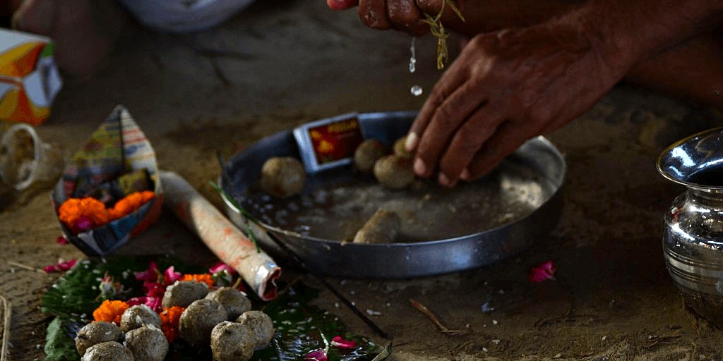 Pind and water offerings during an ancestral ceremony
